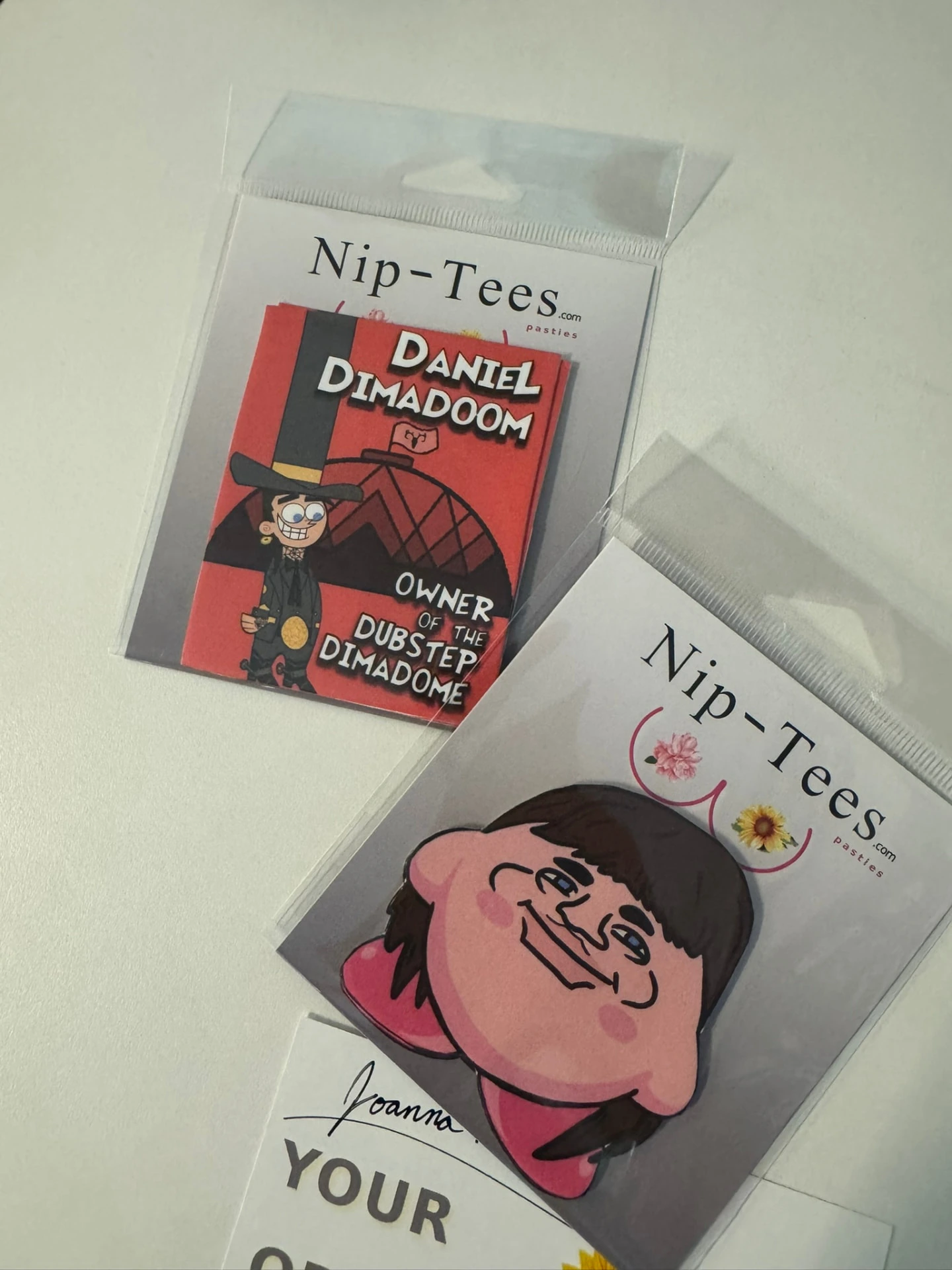 Cartoon face pastie pair with custom character packaging
