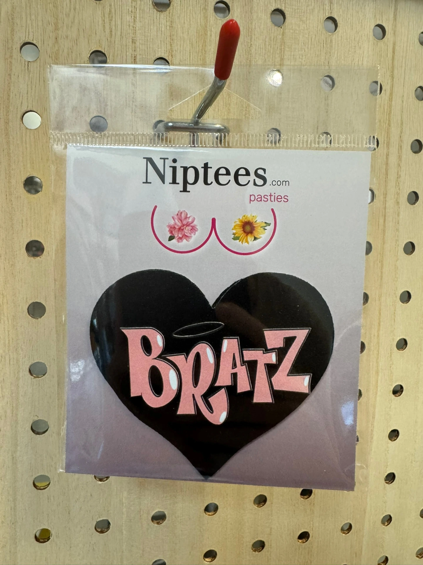Black heart pastie with pink Bratz-style lettering